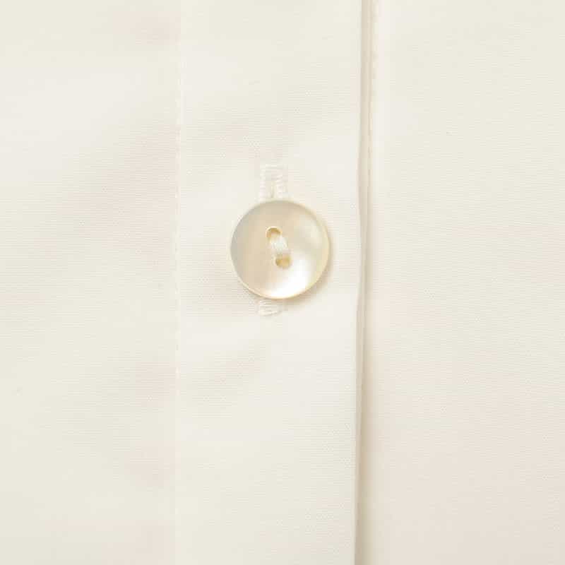 BARNEYS NEW YORK ウォッシャブル バックペプラム パールボタンブラウス WHITE