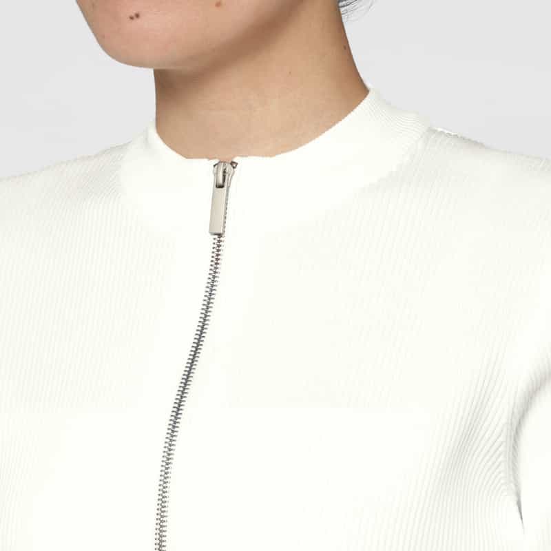 BARNEYS NEW YORK ウォッシャブル ドッキングデザイン フレアヘムジップアップニットプルオーバー WHITE