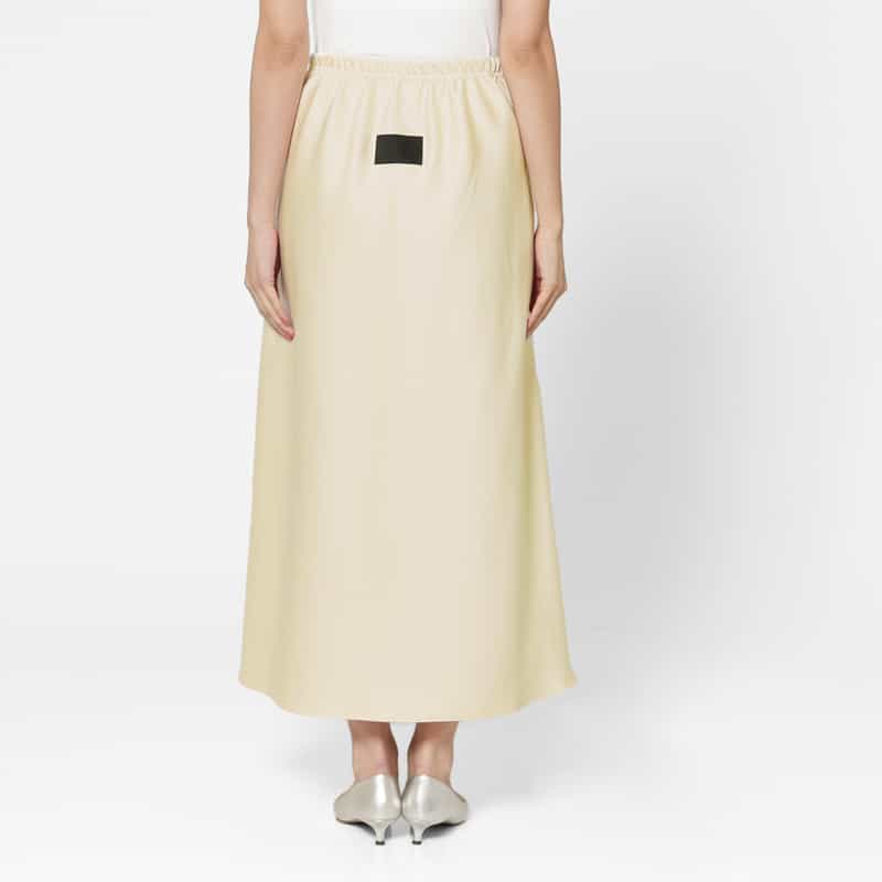 COGTHEBIGSMOKE COGTHEBIGSMOKE ＜コグザビッグスモーク＞ シャイニー素材ドローストリング ロングスカート IVORY